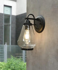 Sharp Badass Hella Waterproof Outdoor Wall Lantern With Slick Clear Glass Shade And Tough Diecast Aluminum Build For Front Porch Or Backyard Vibes Fits E27 mounted on wall.
