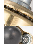 Close-up of Ready To Roll Swivel Stem Ball Caster Wheels With Vintage Antique Brass Style, showing detailed ball bearing and wheel assembly.