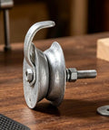 Heavy Duty Galvanized Gate Track Roller Rolls Like A Dream Fits 1 5/8 Inch Pipe with hook and bolt on wooden table.