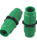 Two green quick connect fittings for expandable garden hose repair kit, compatible with 5/8 and 3/4 inch lines.