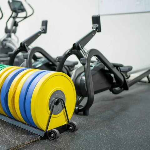 Universal Replacement Wheel Bearing Rollers For Treadmills And Exercise Bikes Heavy Duty Glide Casters, yellow and blue weights on wheels.