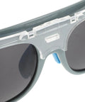 Close up of Heavy Duty Welding Safety Goggles With Interchangeable Lenses, showing clear lens attachment and dark lenses.