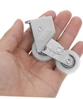 4PC Premium Aluminum Alloy Sliding Door Pulley Wheels With Ball Bearing Replacement Rollers for Patio Door, held in a hand.