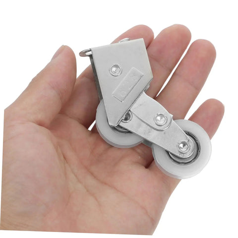 4PC Premium Aluminum Alloy Sliding Door Pulley Wheels With Ball Bearing Replacement Rollers for Patio Door, held in a hand.