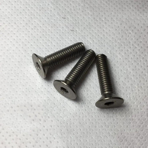 Heavy Duty Kickin' Gr2 Titanium Hex Socket Countersunk Flat Head Screws M6 1.0 X 50Mm Metric Fine Thread Allen Bolts laid on white surface.
