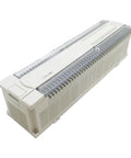 Compact PLC Module Programmable Controller For Industrial Automation With 128 Input Output Points Built Tough For Fast Setup And Smooth Control And Reliable Machine Management In Tough Factory Environments. beige plastic PLC module with 128 terminals