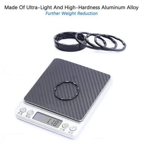 Aluminum Bike Hub Spacer Kit With Grooved Washers And Cassette Spacers for MTB and Road Bikes on digital scale showing 11.8 grams