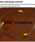 Multi Color Wooden Lazy Susan Round Rotating Serving Tray A Smooth Operator For Dining Tables And Kitchen Counters A Real Deal Hosting Game Changer With Easy Spin Action In Black on a wooden table showing 360° rotation feature.