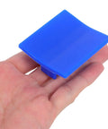 Blue portable tab from Four Piece Auto Body Dent Puller Kit With Manual Expansion And Portable Plastic Tabs For Auto Dent Removal And Sheet Metal Repair Tool Set Built For Dope Results On Door Dents Hail Damage And Body Panel Repair held in hand.
