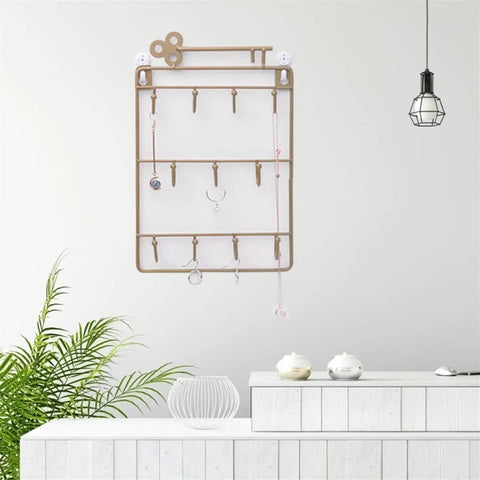 Heavy Duty Iron Wall Coat Rack With Eleven Sick And Sturdy Key And Bag Hooks For Front Door Organization Hat Towel Purse Storage Setup, mounted on wall.
