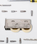 Heavy Duty Stainless Steel Sliding Door Roller With Double Bearing Track Pulley, surrounded by tools for easy installation.