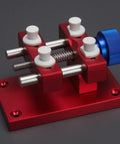 Aluminum Work Holder With Threaded Tightening Screw And Two Sliding Clamps Rock Solid Red Anodized Finish Heavy Duty Workshop Tool For Precise Part Holding And Repair, red aluminum base with blue knob