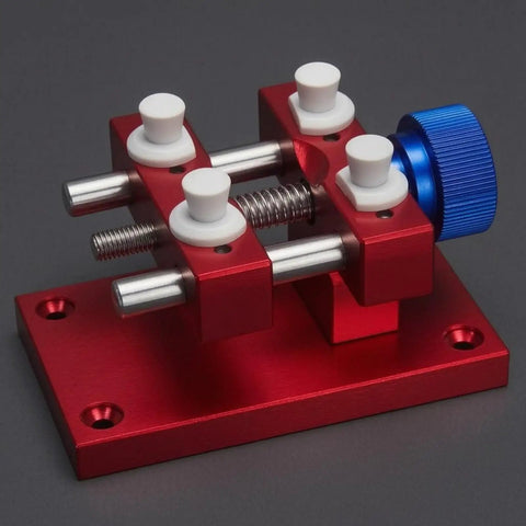 Aluminum Work Holder With Threaded Tightening Screw And Two Sliding Clamps Rock Solid Red Anodized Finish Heavy Duty Workshop Tool For Precise Part Holding And Repair, red aluminum base with blue knob