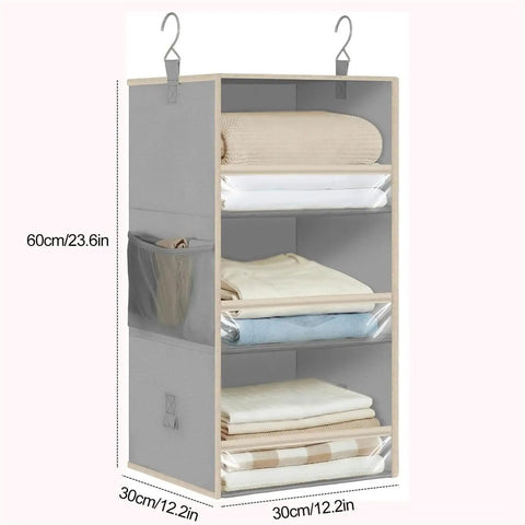 3 Tier Hanging Closet Organizer With Adjustable Detachable Shelves And Clear Window Panels displaying neatly folded blankets and towels.