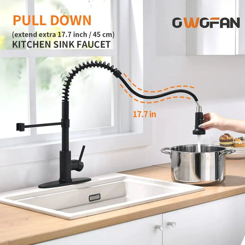 Pro Grade Pull Down Kitchen Faucet With Sprayer, Commercial Spring, High Arc, Single Handle, Black Finish, shown extending over a sink.