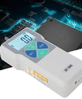 Digital Force Tester Portable Push And Pull Meter For Accurate Load Measurement In Lbs Kilograms And Newtons Units With Long Battery Life And US Plug For Field Or Workshop Use white handheld unit on circuit board