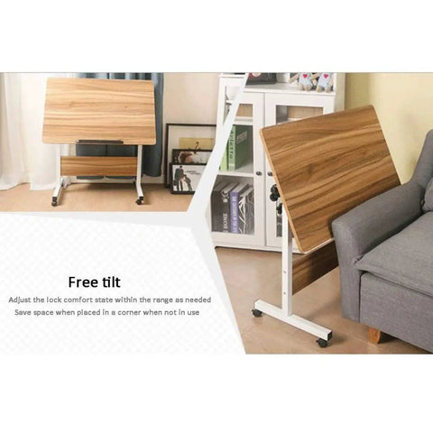 Adjustable Rolling Laptop Desk With Locking Castors Portable Computer Stand tilted for easy access beside a sofa, space-saving design.
