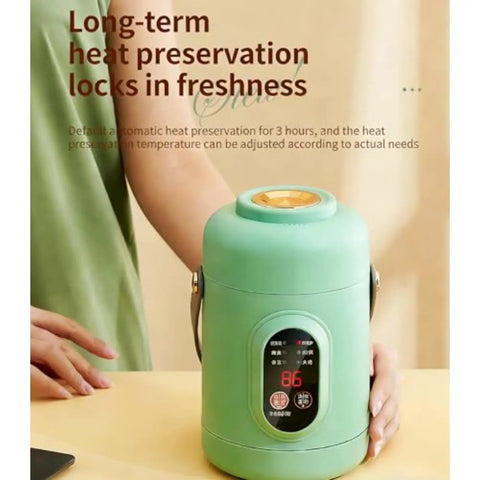 Green Portable 500W Electric Cooker With Ceramic Glaze Inner, Built-In Steamer, 800ml Capacity, shown in a kitchen setting.