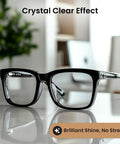 Black plastic eyeglasses with rectangular frames, front view on reflective surface.