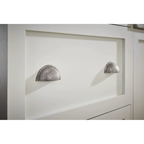 Tough As Nails Rustic Cup Pull Handle For Kitchen Cabinets Designed For The Daily Grind Smooth Glide Action, metallic finish on white cabinet.