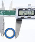 Measuring 10 Pack Workhorse Chrome Steel 6802RS Ball Bearings 15x24x5mm with calipers showing diameter.