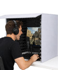 Slick Foldable Microphone Isolation Shield Game Changer Portable Sound Proof Box with heavy duty foam, used by a gamer for podcasting.