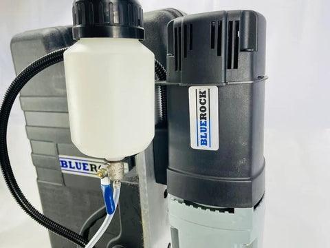 Close-up of the Knockout Performance Heavy Duty Magnetic Drill Press showing motor and fluid container, designed for metal projects.