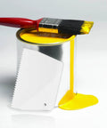 Two Pack Adhesive Spreader Trowel With Three Sixteenth Inch Notch for epoxy projects, shown with paintbrush and yellow paint can.