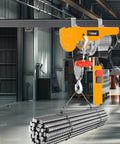 Heavy Duty Electric Hoist Providing 550 Pound Lifting Capacity And Powerful 560 Watt Motor lifting steel rods in a workshop.