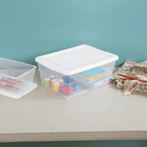 Stackable Clear Plastic Storage Bins 16 Quart 24 Pack holding craft supplies on a table, displaying organization potential.