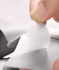 Premium White PVC Adhesive Collar Stays 240 Pack Shirt Collar Protectors For Men Dress Shirts being applied to a shirt collar.