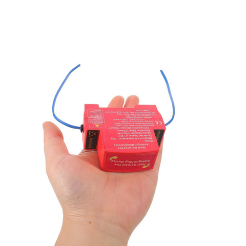 Automatic Car Fire Extinguisher Mini Auto Fire Fighter With Badass Adhesive in hand, compact heat-resistant red casing.