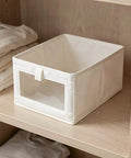 Heavy Duty Cotton Linen Foldable Storage Bins Stackable Closet Organizers on wooden shelf with folded clothes.