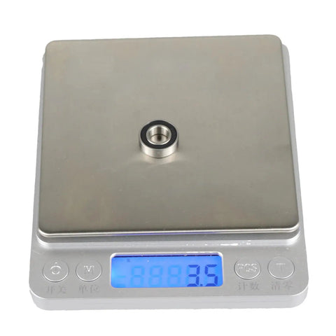 S688-2RS 8x16x5mm ABEC-5 Precision Stainless Steel Ball Bearings on digital scale showing weight of 3.5 grams.