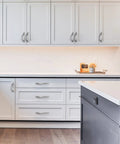 Modern kitchen with 10 pack brushed satin nickel arch twisted cabinet pulls 5 inch hole centers for cabinets and drawers handles installed.