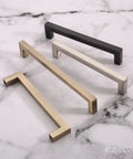 Top Shelf 5 Inch Brushed Antique Brass Cabinet Pulls Square Design Center To Center Drawer Handles For Kitchen Cabinets Dressers And Vanity Furniture 10 Pack Hardware displaying four styles of cabinet pulls on marble.