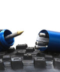 Rock Solid Bicycle Tubeless Tire Repair Tool With Straight Up Puncture Fix Plugs and Trailside Rescue Kit on a mountain bike tire.