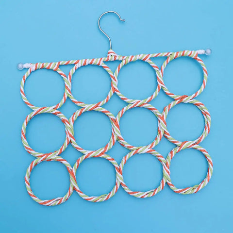 Foldable Paper Rattan Scarf Hanger Featuring 20 Rings And Sturdy Steel Hook Hangs From Door Or Closet Rod for ties and belts, shown flat.