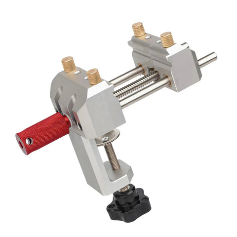 Compact Table Vise With Clamp Base For Tiny Workspaces, Center Screw Control, Guide Track, And Tabletop Part Holder For Close Detail Jobs On Your Busy Bench silver metal clamp-on vise with red handle