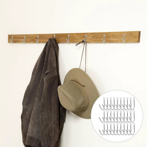Thirty Pack Mini Iron Wall Hooks With Classic Silver Finish holding a jacket and hat on a wooden wall mount.
