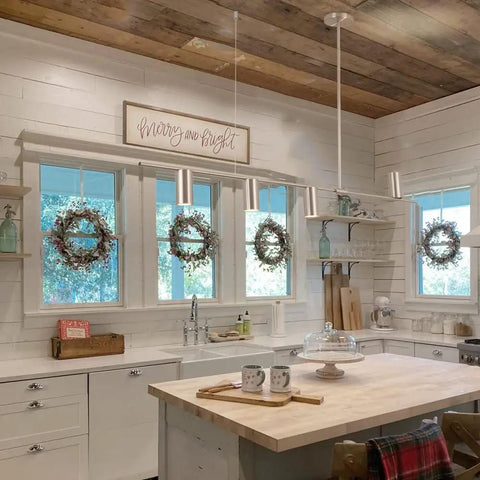 Sleek Modern 4 Light Linear Pendant Chandelier For Dining Room Kitchen Island And Living Room With GU10 Bulbs Dimmable 110V Nickel Finish 47.8 Inch Long Ceiling Light Fixture elegantly installed above a rustic kitchen island.