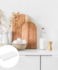 White Mini Finger Edge Pulls 8 Pack Concealed Drawer Handles displayed on kitchen cabinet with decor
