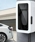 Rock Solid Wall Mounted Charger Cover With Tamper Proof Lock And Integrated Cable Holder For Indoor Outdoor Installations rugged steel box installed beside a white electric car.