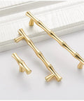 Bamboo Shape Solid Zinc Alloy Cabinet Knobs Set Of 6 In Golden Finish displayed on a white surface, highlighting design and finish.