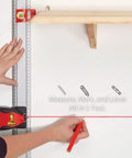 Pro Grade Modular Ruler Attachment With Laser Level And Magnetic Stud Finder Heavy Duty Weekend Warrior Layout Tool in use marking a wall.