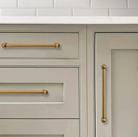 Heavy Duty Zinc Alloy Cabinet Pulls Built To Last Featuring Smooth Operation Antique Brass Hardware on drawers.