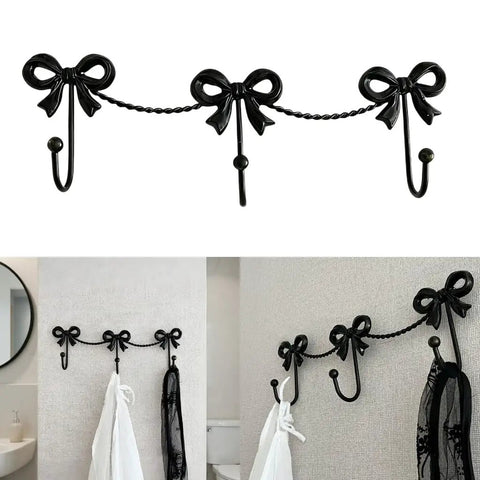 Kickass Heavy Duty Wall Mounted Coat Hook Bulletproof Metal Clothes Hanger with decorative bows in black for entryway use.