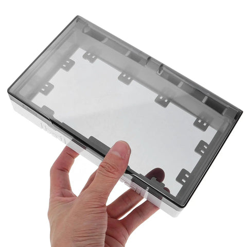 No Sweat Waterproof Outlet Covers With Heavy Duty Adhesive Strip For Quick Home Fixes Total Indoor Outdoor Weather Blocking to keep tiny fingers safe. Finger holding waterproof outlet cover with clear snap-on lid.