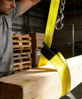 Worker using 2 Inch By 10 Foot Heavy Duty Lift Sling Web Strap With Wear Guard End And Flat Eye Reinforced Loops 15000 Lb Capacity
