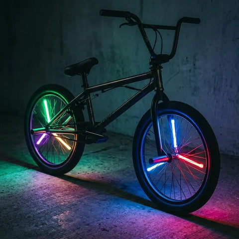 Dark bike with Color Changing LED Bike Spoke Lights Clip-On Wheel Lights That Morph Through Colors for Kids and Adults.